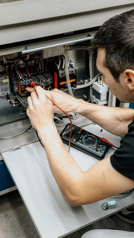 Electrician working on a panel